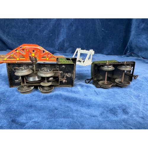 105 - A tin plate clockwork model of a Great Western steam engine and tender with model bridge and Hornby ... 