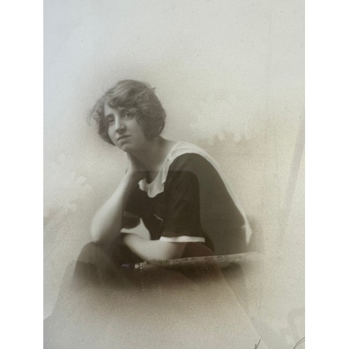 61 - A framed black and white photograph of a seated lady with signature Lilian Ream.