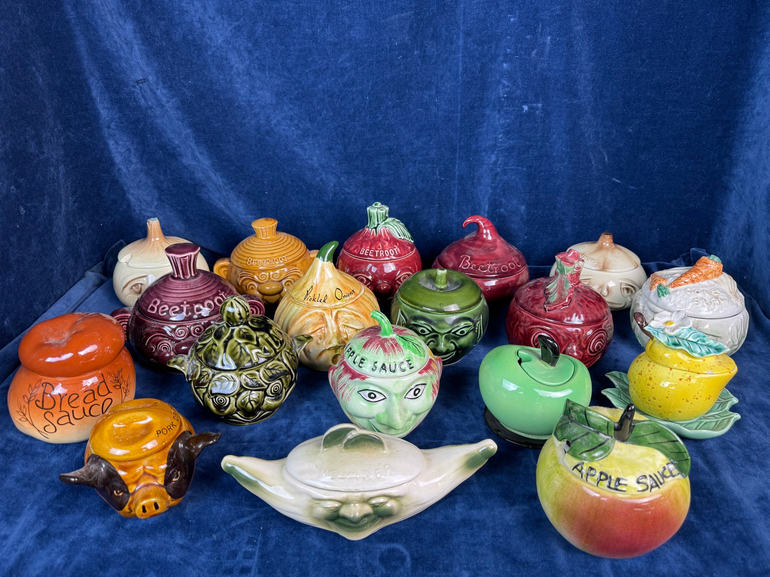 A collection of faced condiment pots, including 2 Sylvac crying onions ...