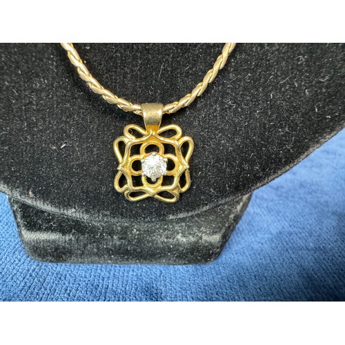 196 - A 9ct gold ladies necklace with contemporary pendant, having single stone, weighing approximately 8.... 