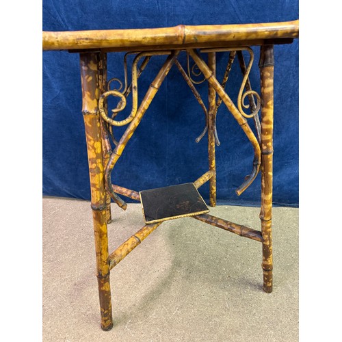 610 - A bamboo framed square side table having cross shaped stretcher, with hand painted top depicting bir... 