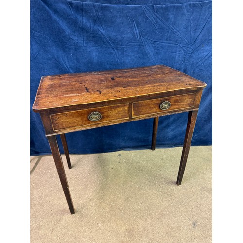 609 - An antique mahogany side table on square legs with 2 drawers under, having metal oval shaped handles... 