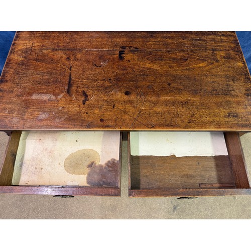 609 - An antique mahogany side table on square legs with 2 drawers under, having metal oval shaped handles... 