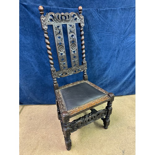 608 - An antique carved hall chair on turned legs and stretchers with barley twist side supports and carve... 