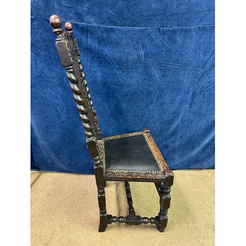 608 - An antique carved hall chair on turned legs and stretchers with barley twist side supports and carve... 