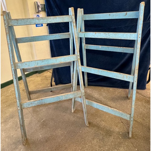 18 - A vintage pair of wooden trestles, having metal hinges, painted in sky blue colour.