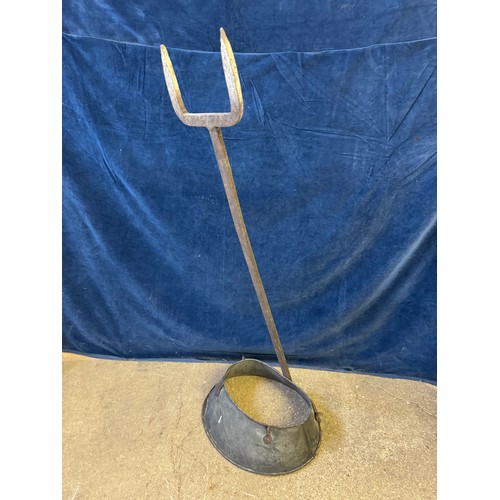 26 - A galvanised potato hopper on fork stand.