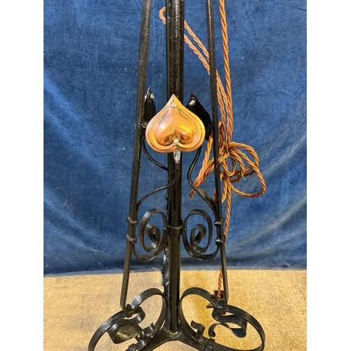 21 - A metal adjustable standard lamp in the Art Nouveau style, on 3 feet and having copper heart design.