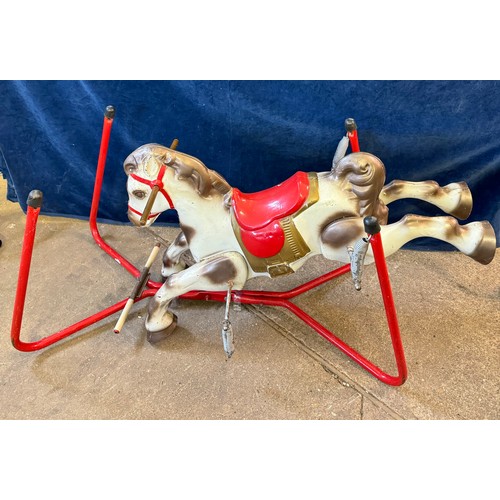 17 - A vintage metal child's toy rocking horse toy on springs, and red base frame.