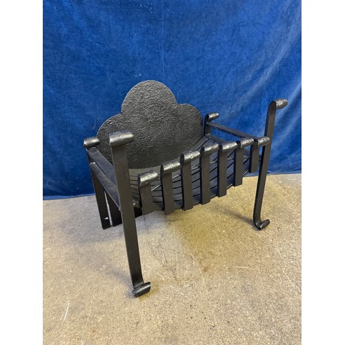 28 - A hand forged metal open fire grate.