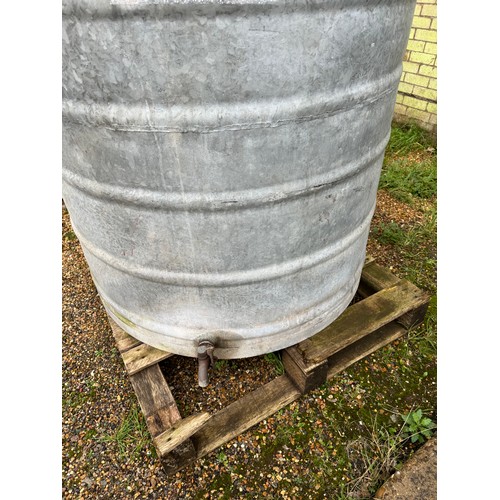 1 - A large galvanized fuel storage tank of ribbed design together with tap and cap. Measuring approx 13... 