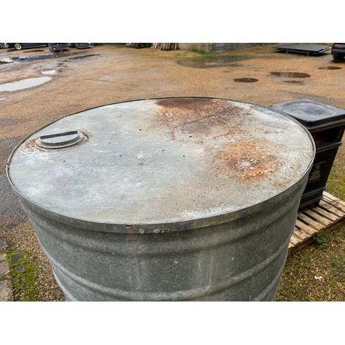 1 - A large galvanized fuel storage tank of ribbed design together with tap and cap. Measuring approx 13... 