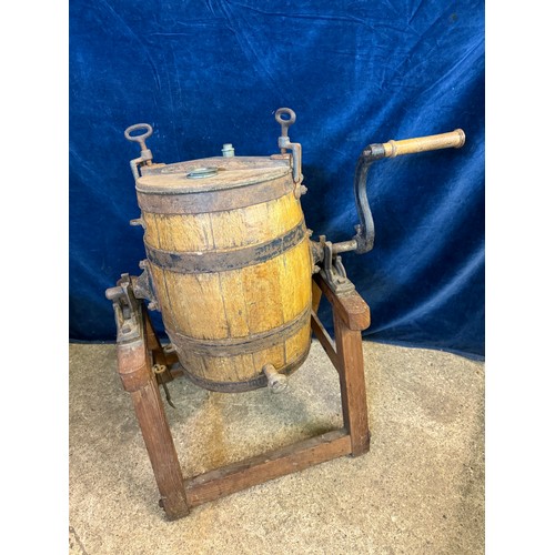 10 - A vintage barrel butter churn on wooden stand, with suppliers label - Corts Limited, Ironmongers.