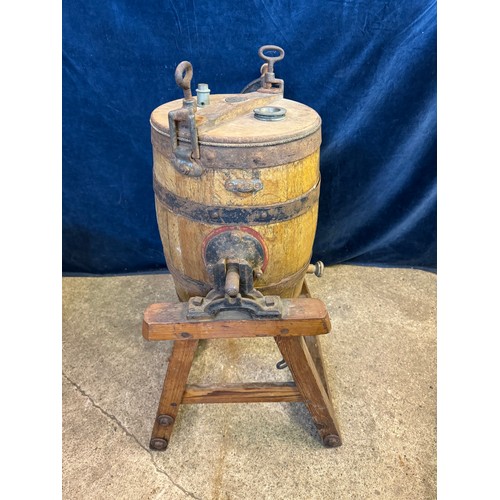 10 - A vintage barrel butter churn on wooden stand, with suppliers label - Corts Limited, Ironmongers.