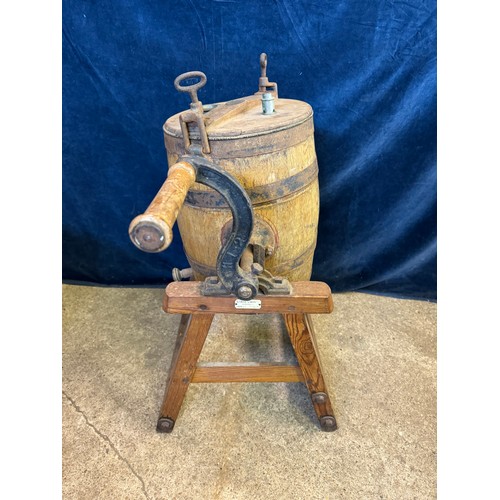 10 - A vintage barrel butter churn on wooden stand, with suppliers label - Corts Limited, Ironmongers.