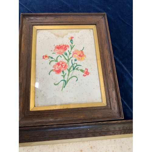 68 - Three framed vintage needlework pictures depicting flowers.