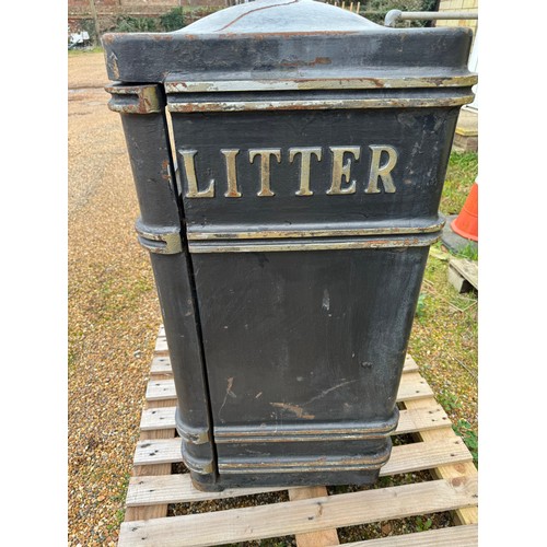 2 - A metal litter bin.