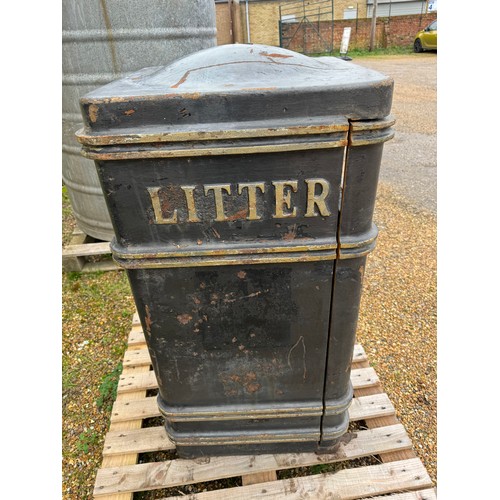 2 - A metal litter bin.