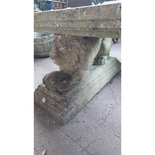 46 - CONCRETE GARDEN BENCH WITH LION AND BALL ON PLINTH BASE - (160CM ) LONG, (66CM) DEPTH, (47CM) HEIGHT