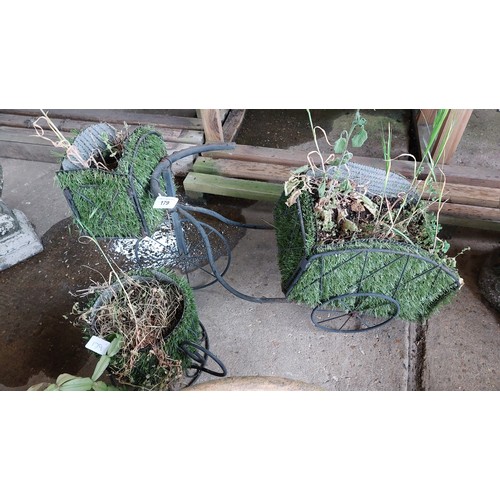 179 - 2 METAL FRAMED PLANTERS - TEA CUP & A TRICYCLE