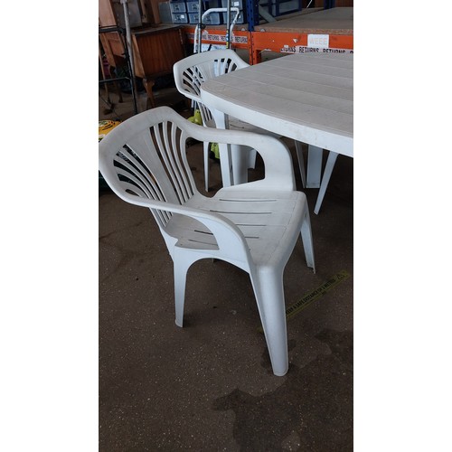 265 - WHITE PLASTIC TABLE WITH 4 GARDEN CHAIRS