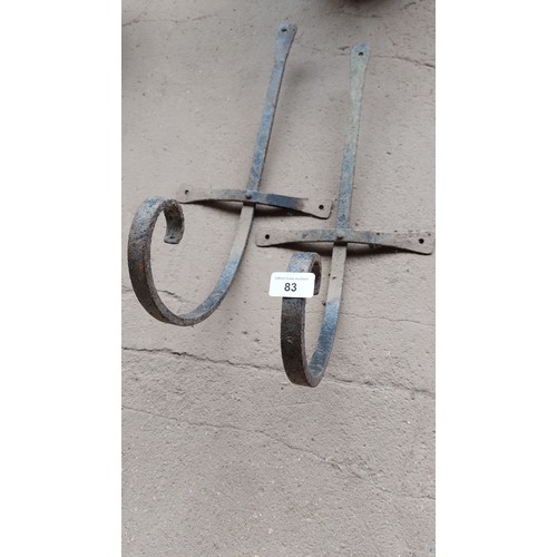 83 - PAIR OF WROUGHT IRON WALL BRACKETS