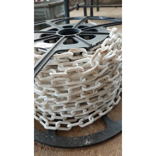 122 - BLACK REEL OF WHITE CHAIN LINK FENCING