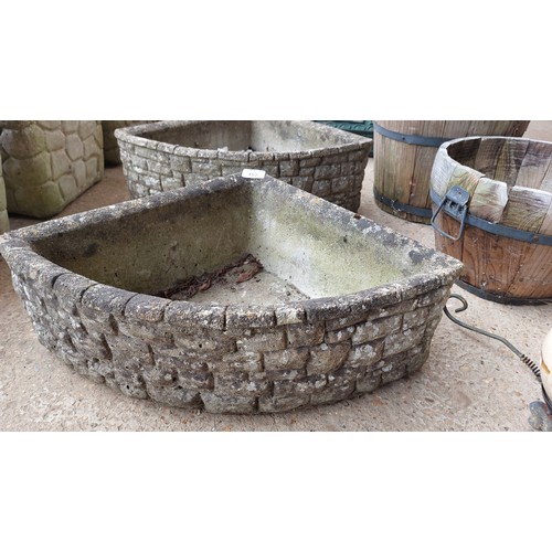 152 - PAIR OF CONCRETE CORNER PLANTERS