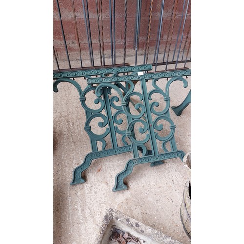 153 - 2 CAST IRON HEAVY ARMCHAIRS AND GARDEN TABLE ENDS