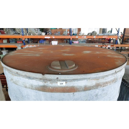 229 - LARGE GALVANISED ROUND WATER TANK WITH BRASS TAP. HEIGHT 136CM, WIDTH 108CM