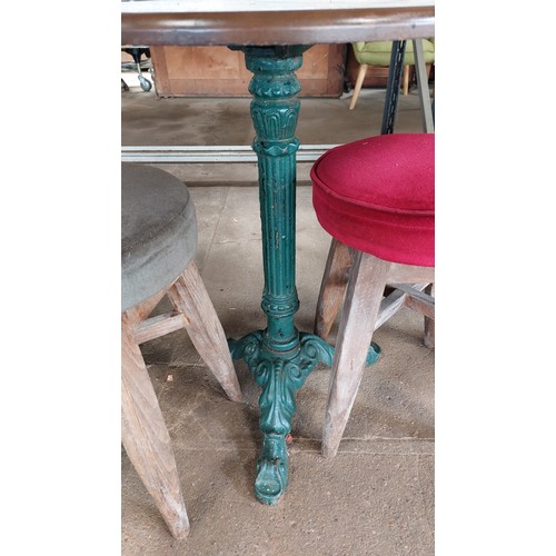 363 - HEAVY GREEN CAST IRON BASE WOOD TOP TABLE WITH 2 STOOLS