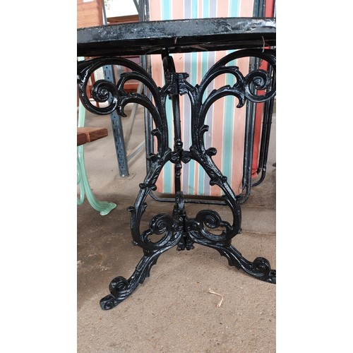 372 - BLACK CAST METAL FLORAL TOP TABLE WITH 3 LEG ORNATE BASE