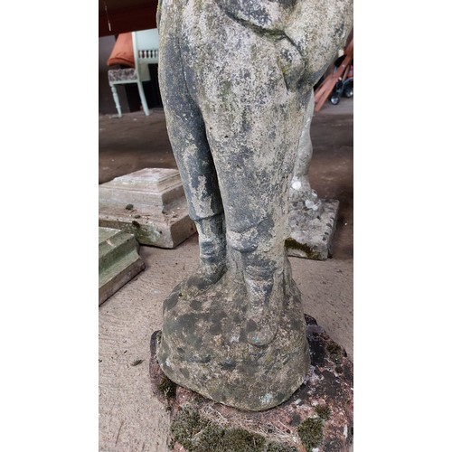 395 - CONCRETE GARDEN ORNAMENT OF A BOY WITH HIS HANDS IN HIS POCKETS - HEIGHT 66CM