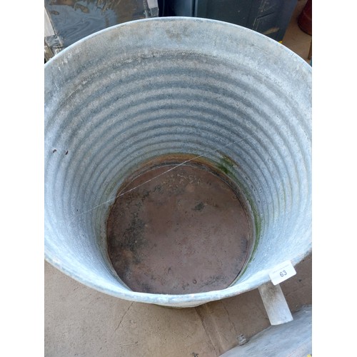 63 - GALVANISED LARGE ROUND WATER TANK, MEASURES APPROXIMATELY 64CM X 74CM HIGH.