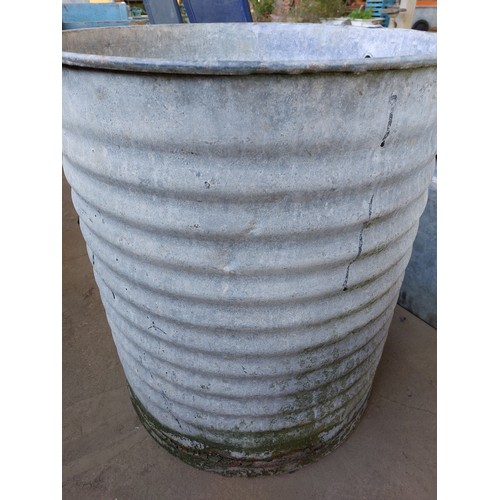 63 - GALVANISED LARGE ROUND WATER TANK, MEASURES APPROXIMATELY 64CM X 74CM HIGH.