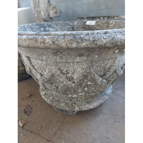 34 - A PAIR OF RECONSTITUTED STONE PLANTERS WITH RELIEF DECORATION