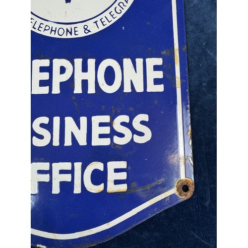 46 - A vintage enamel sign reading 'Southwestern Bell telephone Co - American telephone & telegraph Co - ... 