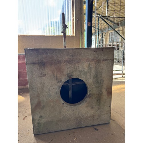 A large riveted galvanized tank, with tap and porthole. Height 108cm x ...