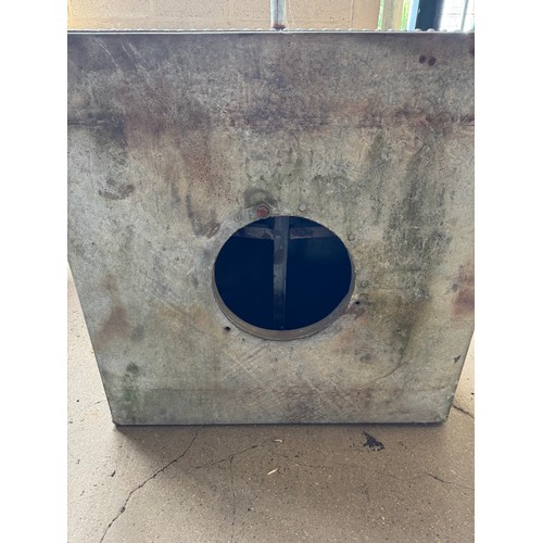 A large riveted galvanized tank, with tap and porthole. Height 108cm x ...