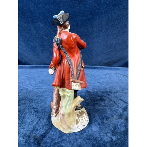 216 - A pair of Dresden porcelain figures depicting a huntsman with rifle and a dog, and a lady holding a ... 