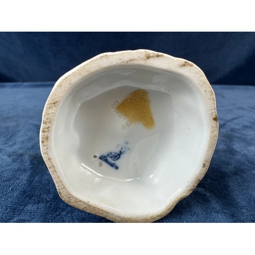 216 - A pair of Dresden porcelain figures depicting a huntsman with rifle and a dog, and a lady holding a ... 