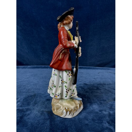 216 - A pair of Dresden porcelain figures depicting a huntsman with rifle and a dog, and a lady holding a ... 