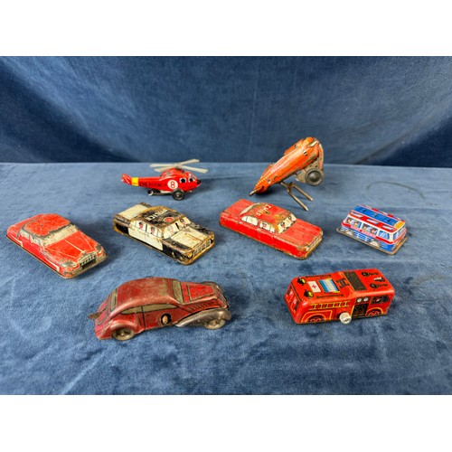 248 - A collection of 8 tin plate toy vehicles, including; A Kanto toys fire engine, 2 helicopters, police... 