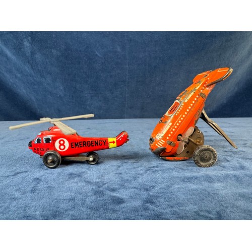248 - A collection of 8 tin plate toy vehicles, including; A Kanto toys fire engine, 2 helicopters, police... 