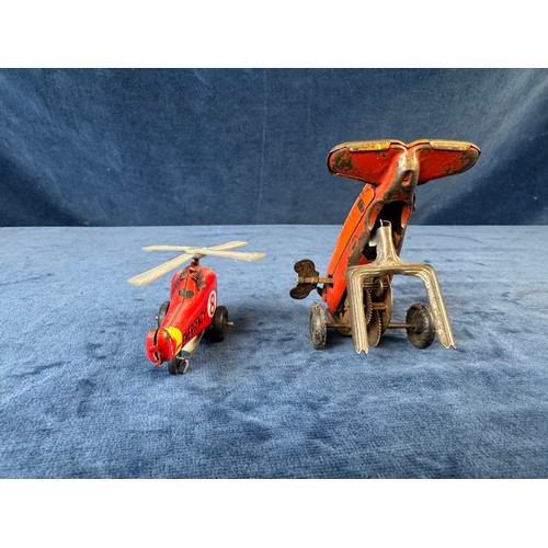 248 - A collection of 8 tin plate toy vehicles, including; A Kanto toys fire engine, 2 helicopters, police... 