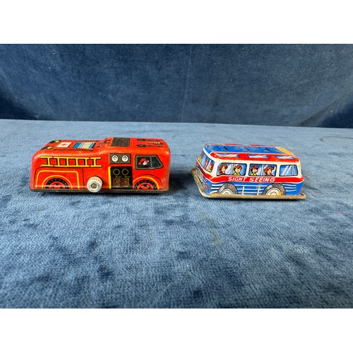 248 - A collection of 8 tin plate toy vehicles, including; A Kanto toys fire engine, 2 helicopters, police... 