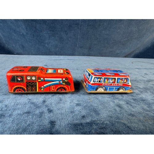 248 - A collection of 8 tin plate toy vehicles, including; A Kanto toys fire engine, 2 helicopters, police... 