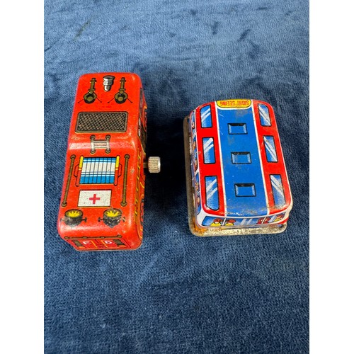 248 - A collection of 8 tin plate toy vehicles, including; A Kanto toys fire engine, 2 helicopters, police... 