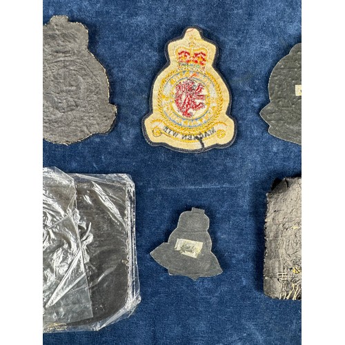 164 - A bomber command badge, together with other fabric badges.