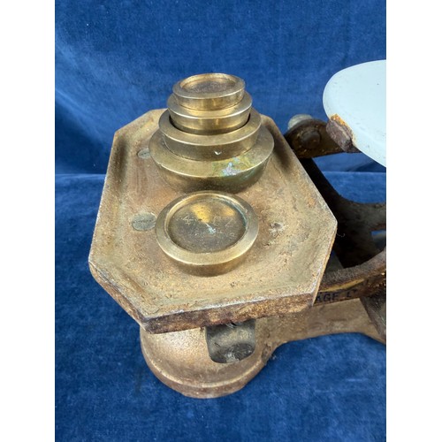 276 - A vintage set of weighing scales with ceramic weighing platform, marked 